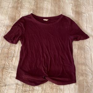 Maroon T shirt, with tie/crossover at bottom